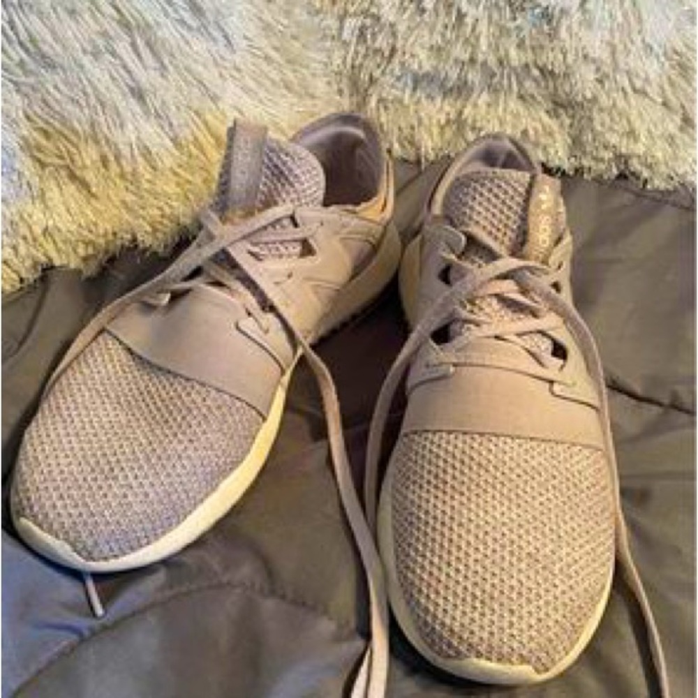 Lilac Adidas sneakers.  Worn